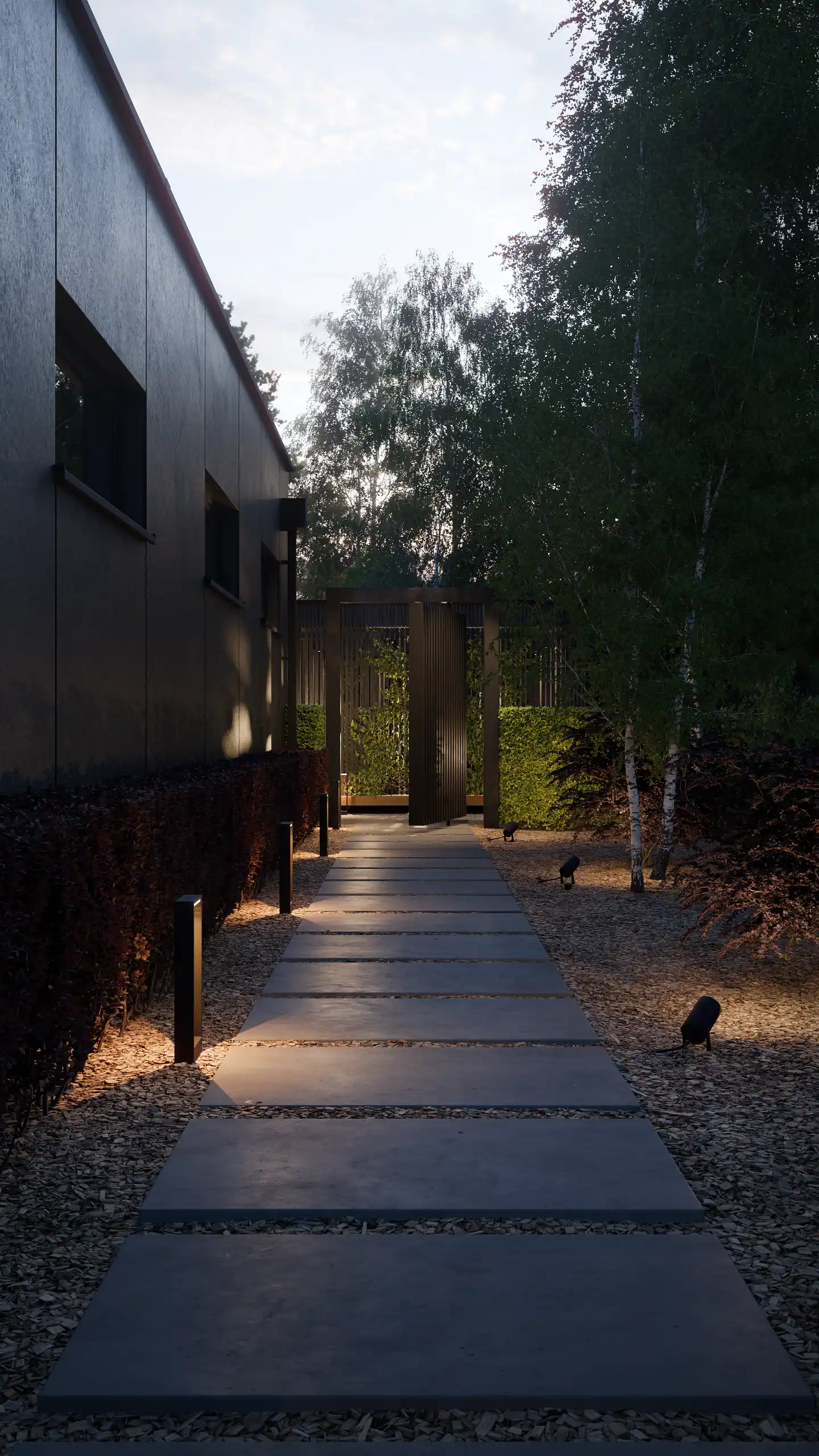 Nowoczesna ścieżka ogrodowa z płyt betonowych wieczorem. Projekt oświetlenia ogrodowego, lampy stojące i reflektory kierunkowe przy ciemnej elewacji domu modern barn – NAIMAD STUDIO.