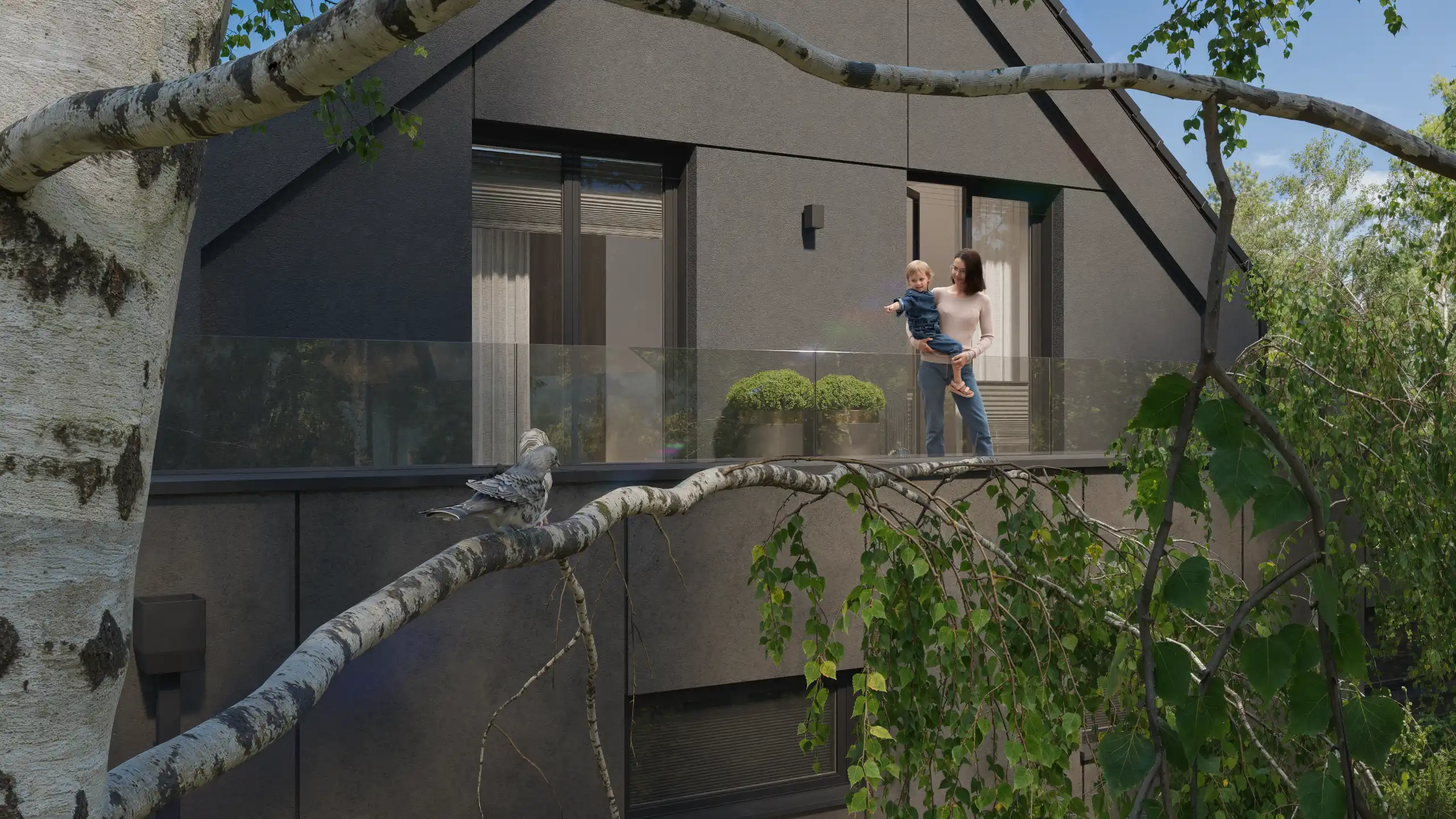 Nowoczesna elewacja domu modern barn z tarasem i szklaną balustradą. Widok na ciemną elewację budynku zza gałęzi dojrzałej brzozy, projekt otoczenia budynku premium – NAIMAD STUDIO.