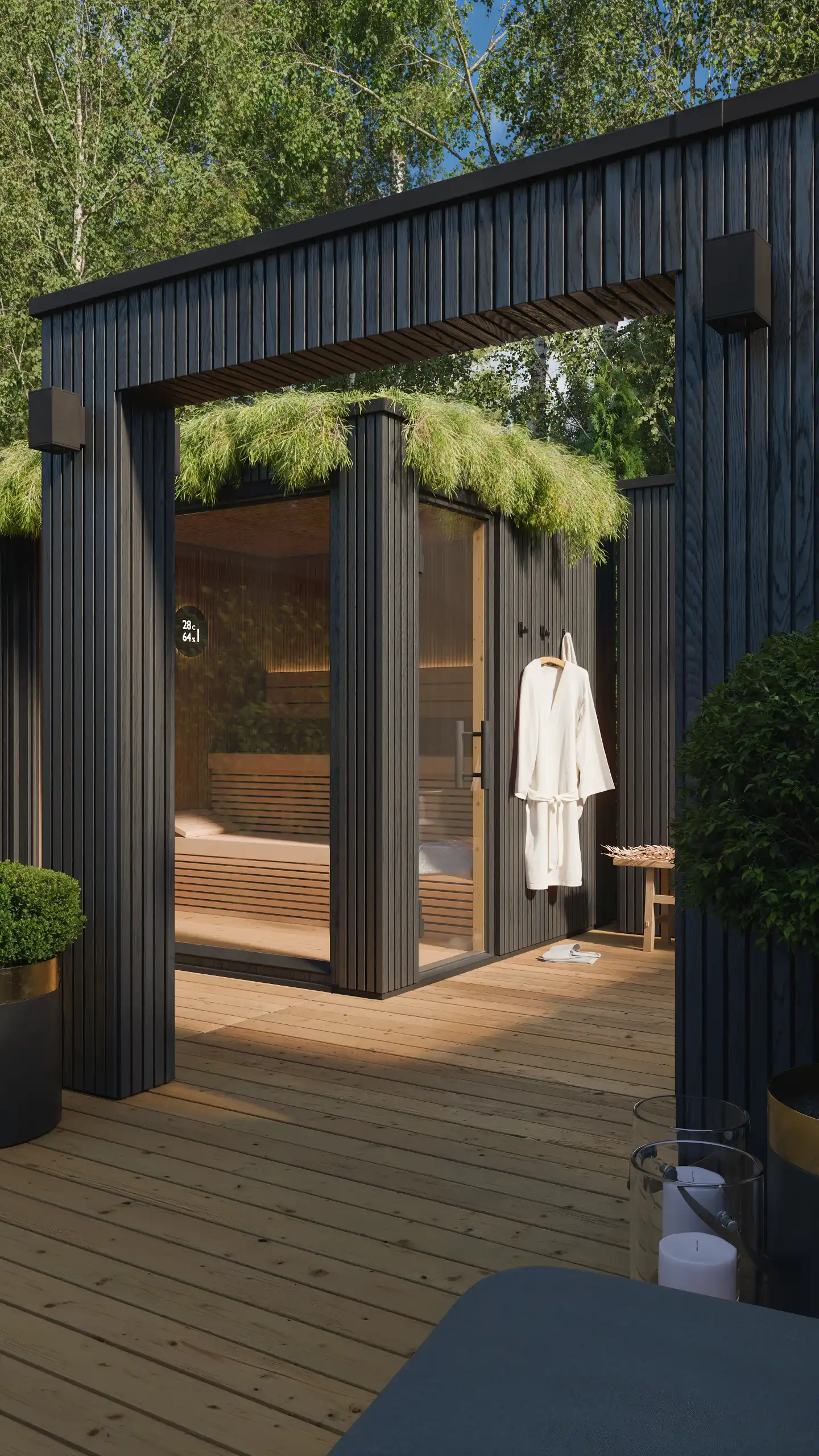 Nowoczesna sauna ogrodowa z dachem zielonym i dużym przeszkleniem w dzień. Projekt nowoczesnego domku saunowego z elewacją z czarnego drewna i drewnianym tarasem – NAIMAD STUDIO.
