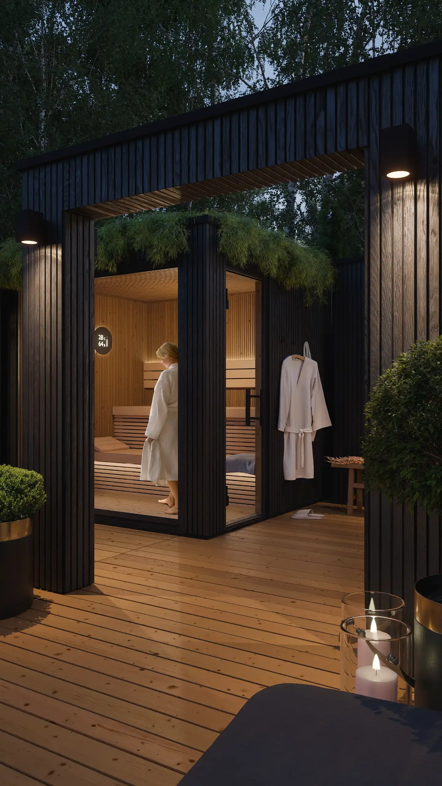 Ekskluzywna sauna ogrodowa wieczorem z podświetleniem led wnętrza i cyfrowym sterownikiem. Projekt nowoczesnego domku saunowego z dachem zielonym i elewacją z czarnego drewna – NAIMAD STUDIO.